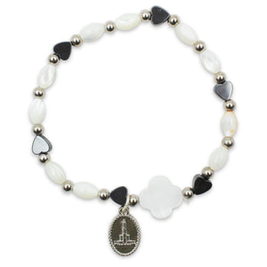 Our Lady of Fatima Stretch Bracelet – White Oval Beads with Black Heart Accents and Fatima Medal Charm