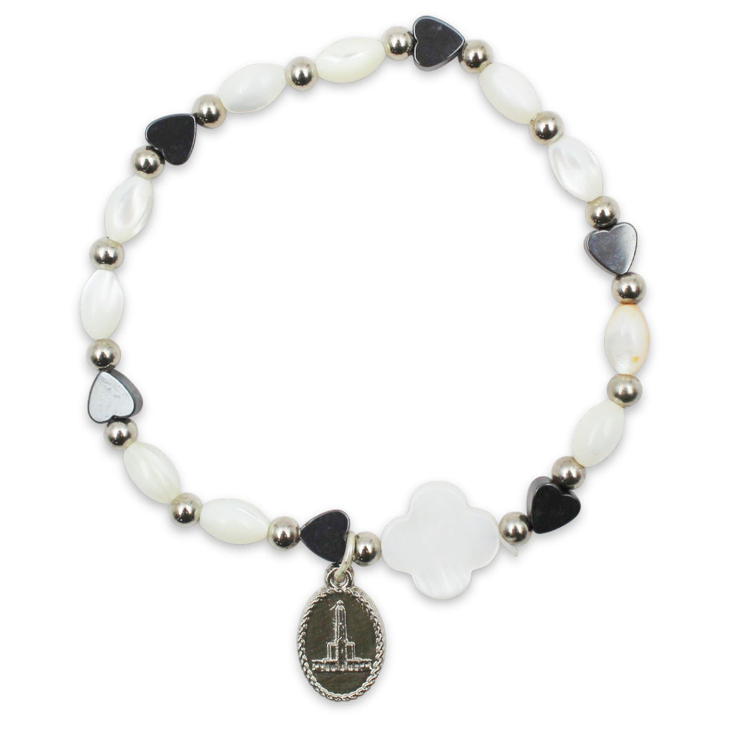 Our Lady of Fatima Stretch Bracelet – White Oval Beads with Black Heart Accents and Fatima Medal Charm