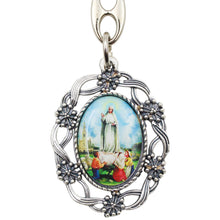 Load image into Gallery viewer, Our Lady of Fatima Oval Keychain with Floral Silver Tone Frame
