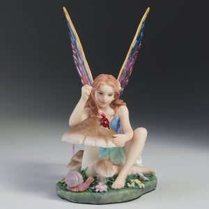 Fairy Figurine Painting Ladybug on Mushroom – Colorful Winged Fairy Statue with Nature Accents