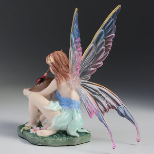 Fairy Figurine Painting Ladybug on Mushroom – Colorful Winged Fairy Statue with Nature Accents
